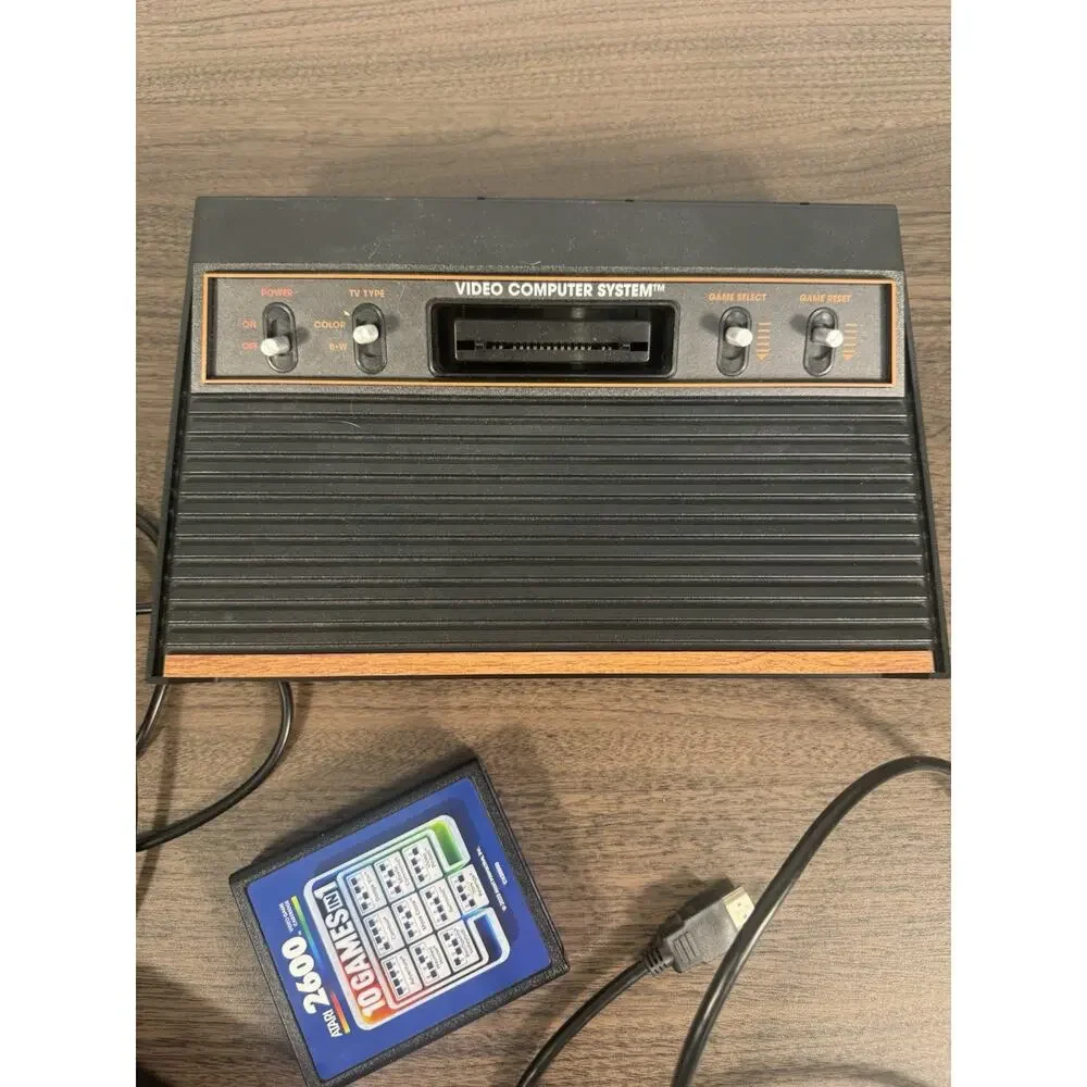 atari 2600 console with joystick, cables and‎ one cartridge with 10 game working